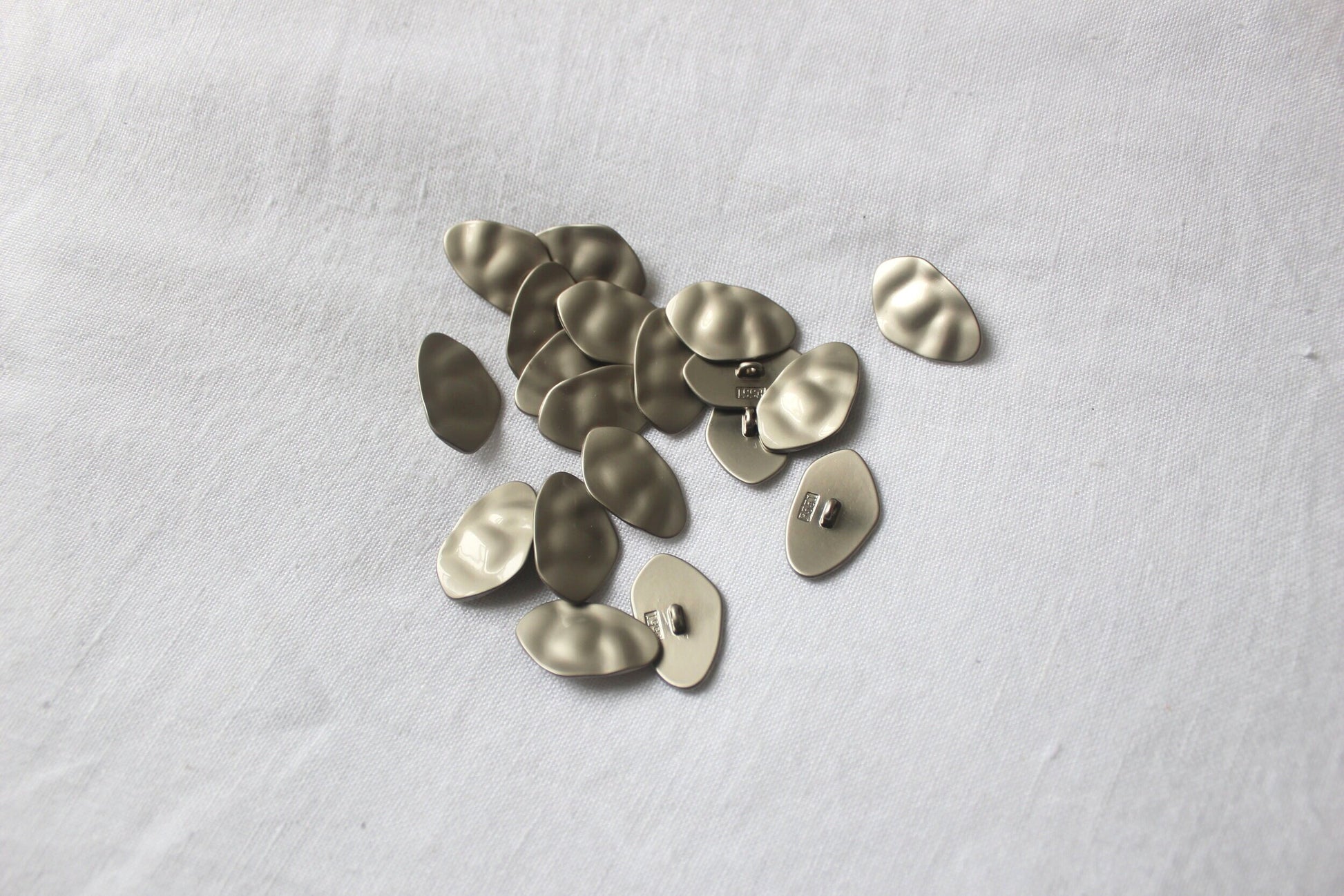 textured matte silver metal buttons 25mm x 15mm